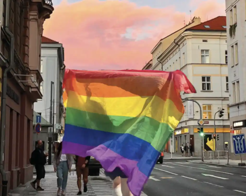 big lgbt flag held in the street in prague